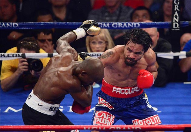 Manny Pacquiao punches Timothy Bradley Jr